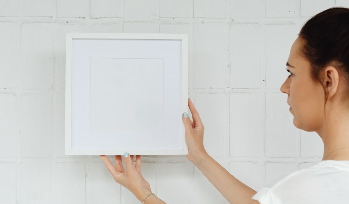Corner wall gallery with layered picture frames