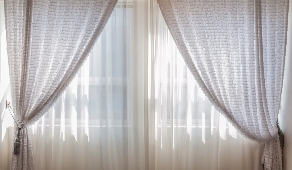 Sunlight coming through curtains in a cozy room