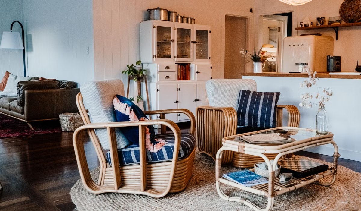 Boho living room with rattan chairs, jute rug and striped cushions
