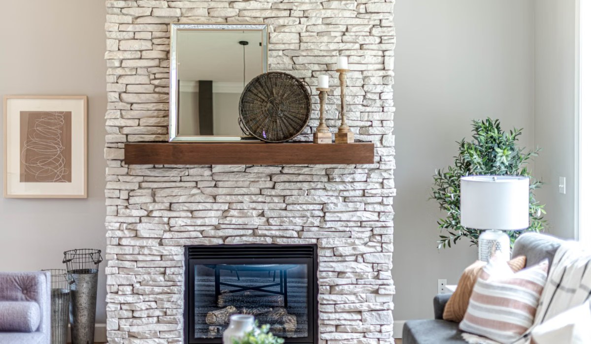 Cozy living room with a stone fireplace and styled decor