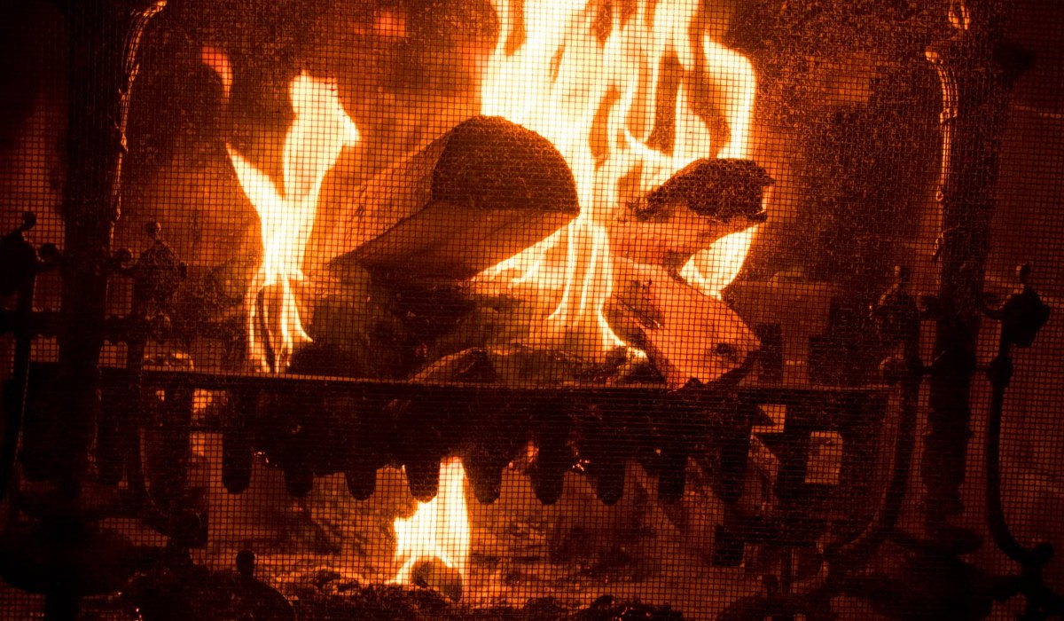 Glowing fireplace with burning logs