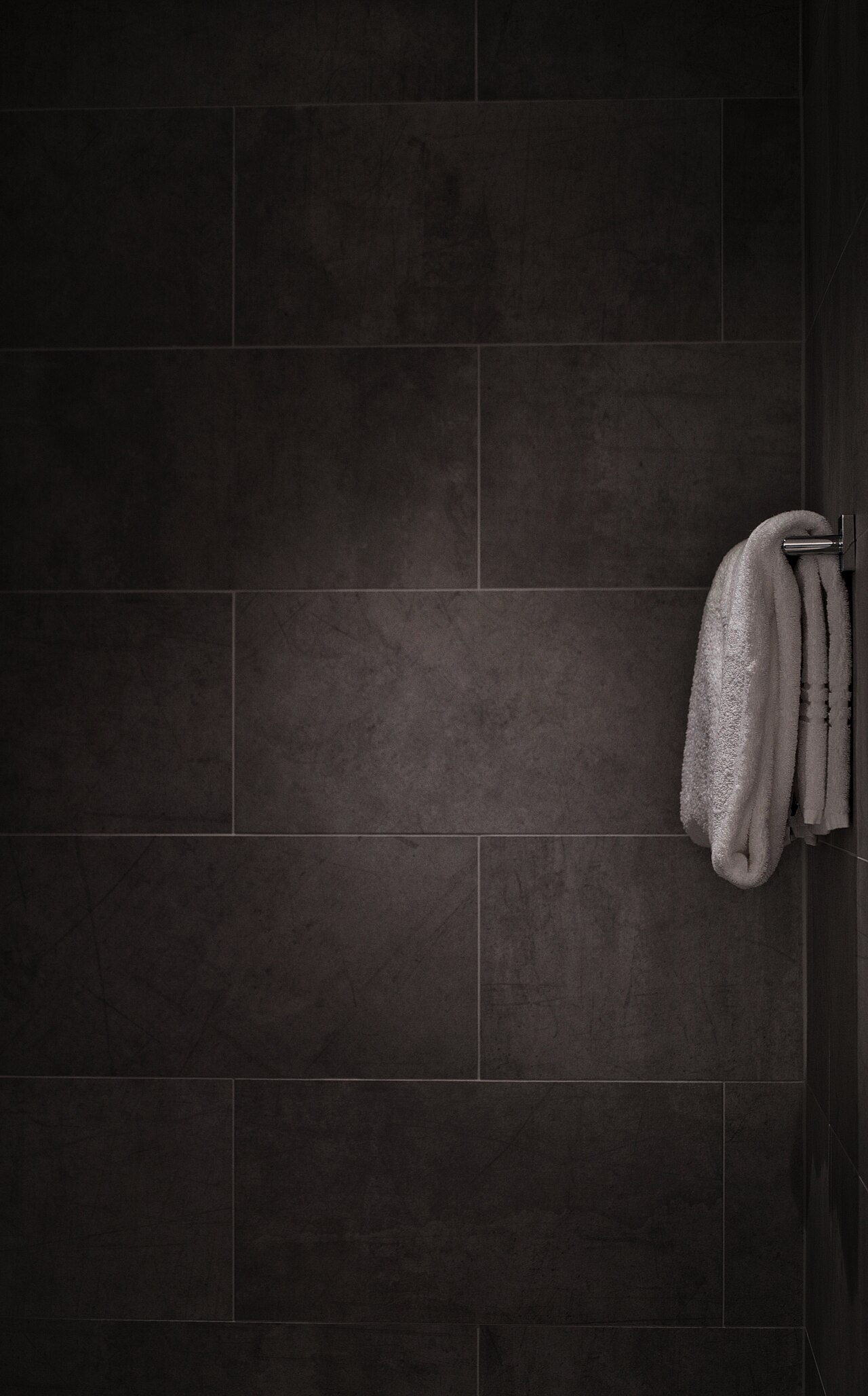 White towel in tiled bathroom (CC0 photo)