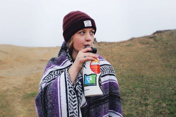 Woman drinking from bottle (CC0 photo)